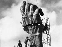 Treister said the arm represents his portrayal of a scene from hell, frozen in bronze. A giant outstretched arm, marked with a Nazi prisoner’s tattoo, rises from the earth; the final reaching out of a dying person. The hand, almost in place. Miami Beach, 