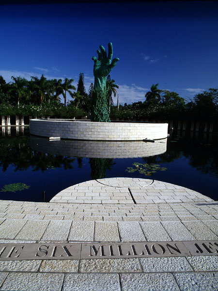 <strong>The Garden of Meditation</strong> The Garden is composed of a large plaza of Jerusalem stone, a 200-foot-diameter water lily pond, and a classic semicircular colonnade and arbor, all set against a backdrop of a dense green palm forest. 