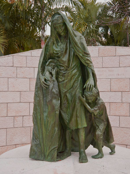 <strong>The First Sculpture</strong> The first sculpture is of a mother and two nestling children, fearful as the signs of the Holocaust first appear. 