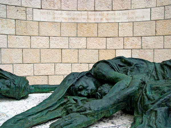 <strong>The Final Sculpture</strong> The final sculpture depicts the same mother and two children who started the journey, now dead, framed by the words of Anne Frank: “Ideals, dreams and cherished hopes rise within us only to meet the horrible truths and