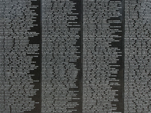 <strong>The Memorial Wall</strong> Not unlike the Vietnam Memorial, this Holocaust Memorial Wall serves many of the survivors and their families as the only real link with their loved ones, a place where families can see the names of a loved one carved in